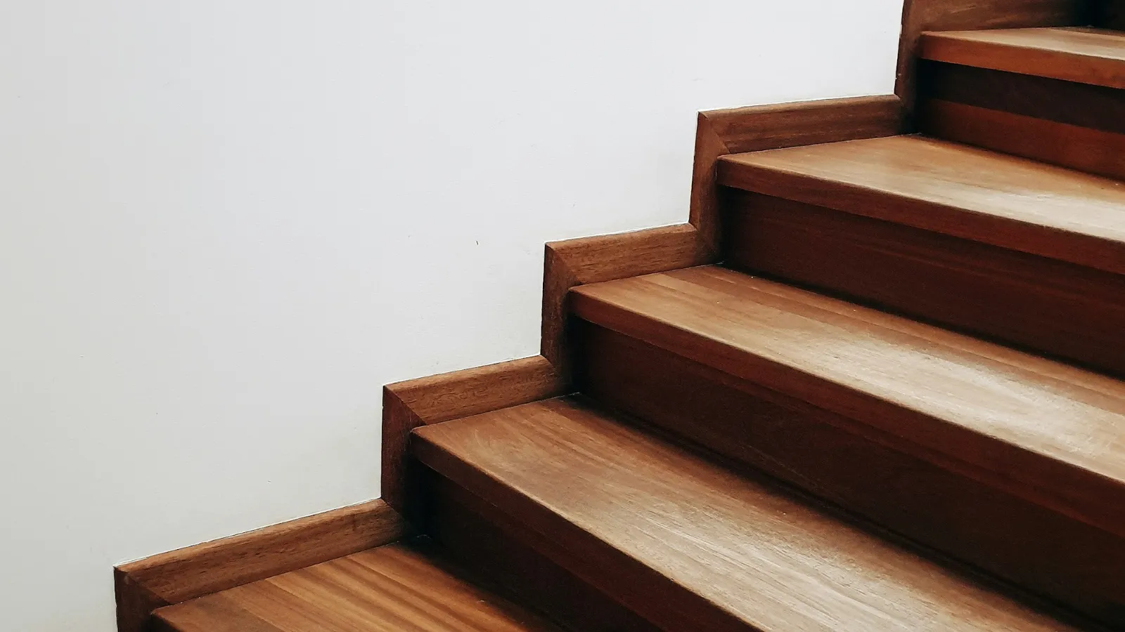 Bare timber stairs before a runner is fitted
