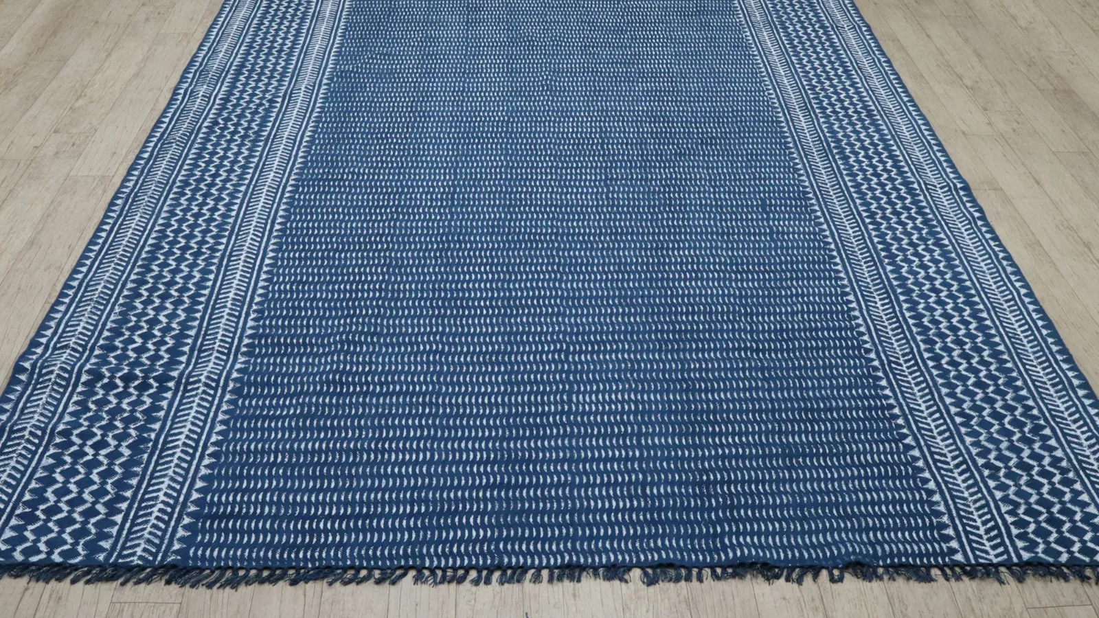 Blue flat-woven rug