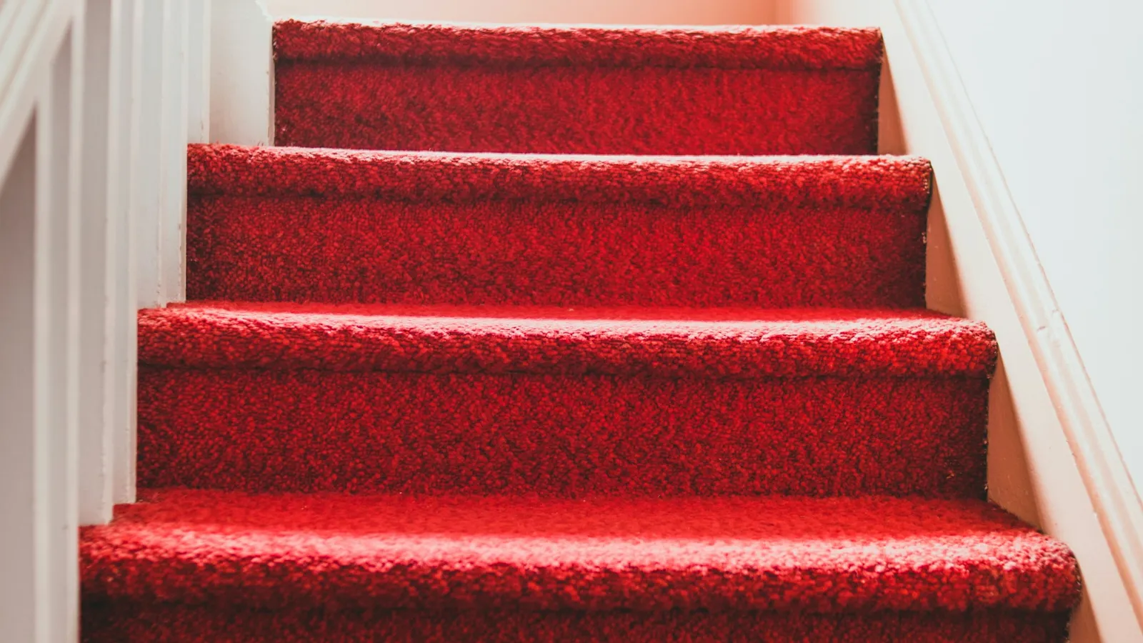 Bright red carpet on a straight run of steps
