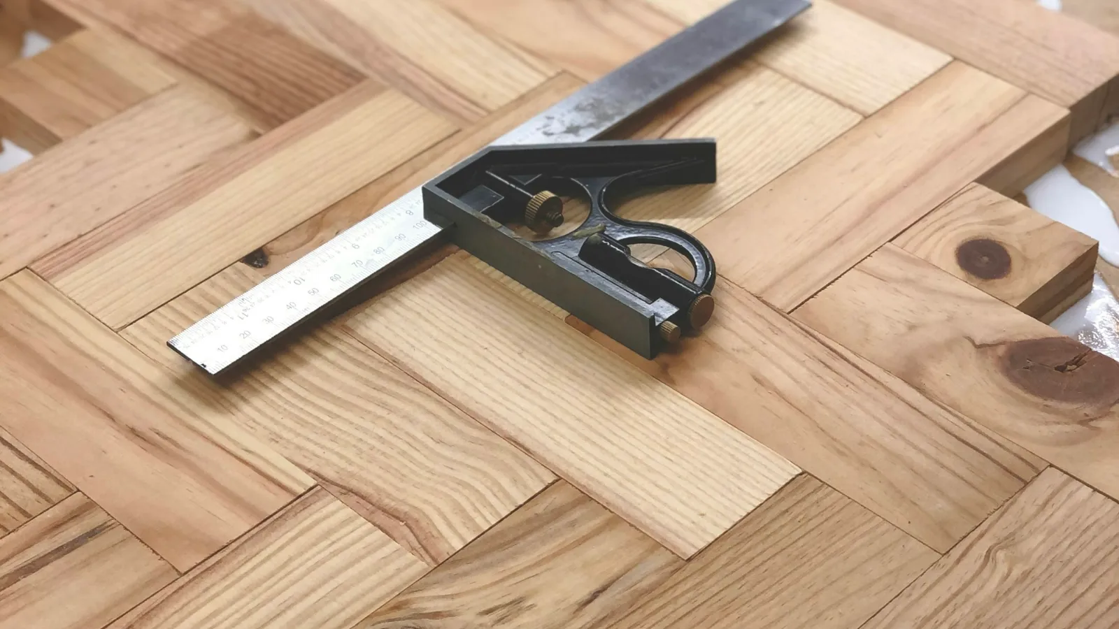 Carpenter's square on a timber floor