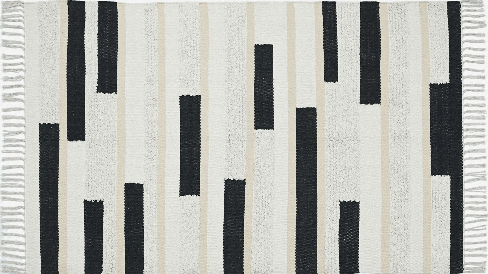 Cream rug with black graphic marks