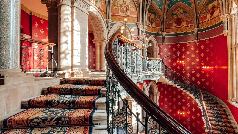 Patterned runner on an ornate Victorian staircase
