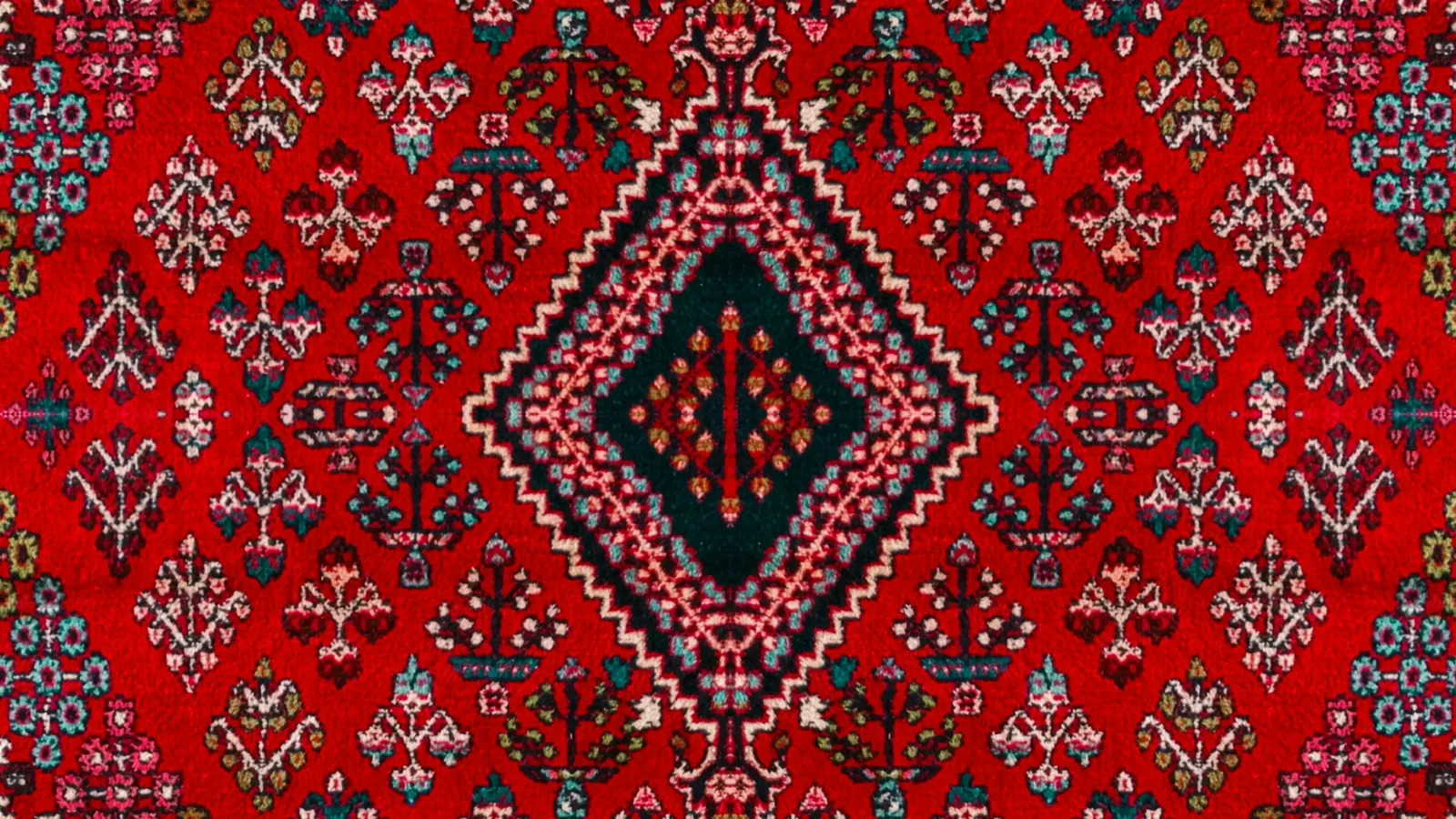 Red oriental rug with a central medallion