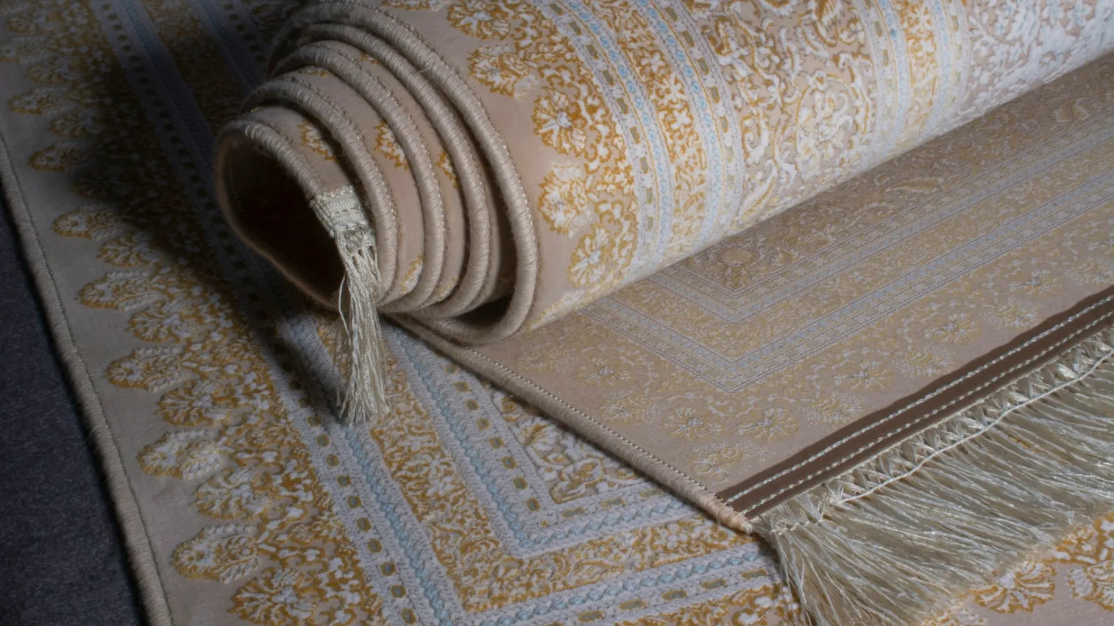Rolled patterned rug ready to be laid