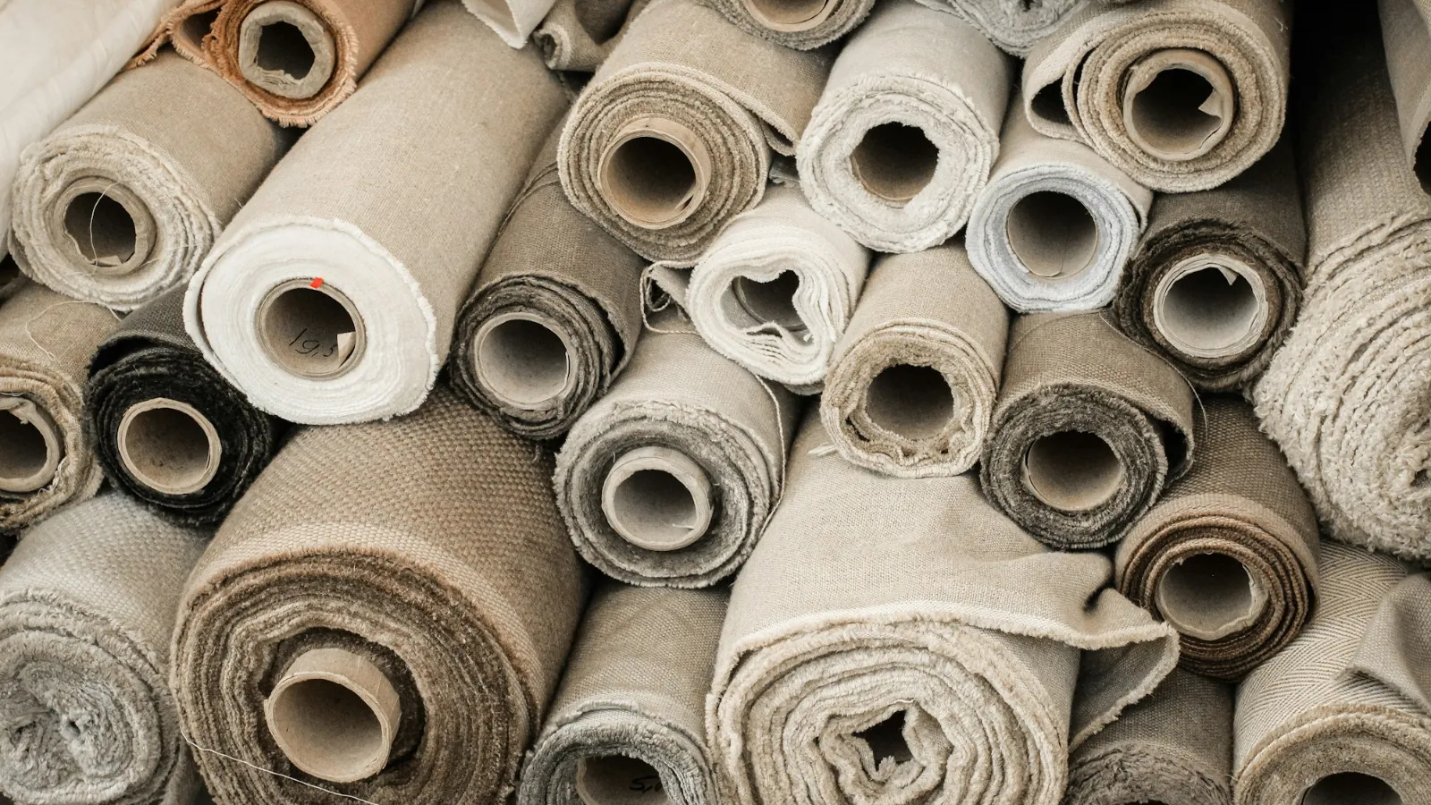 Rolls of carpet stacked in a store