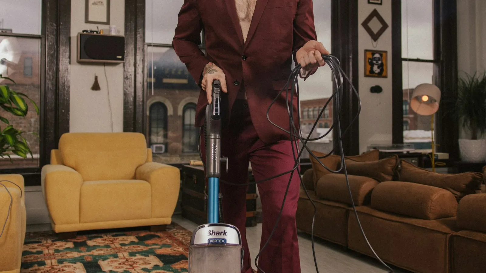 Upright vacuum cleaner in use in a living room